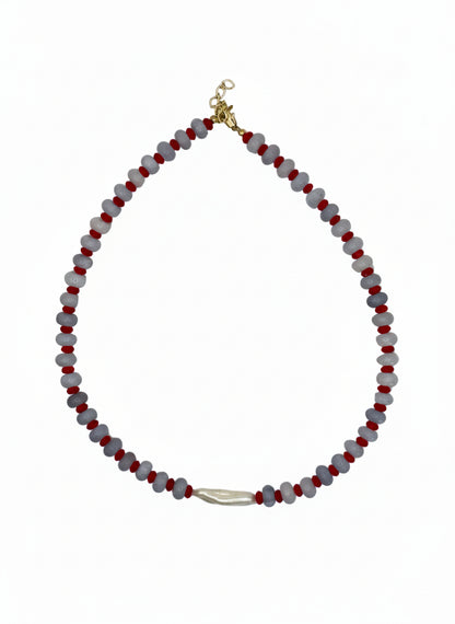 Necklace with red and gray beads on a white background
