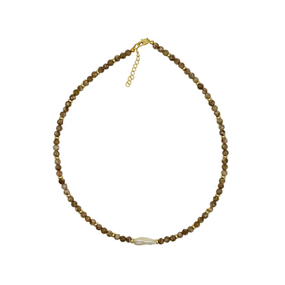 Beaded necklace on a light gray background