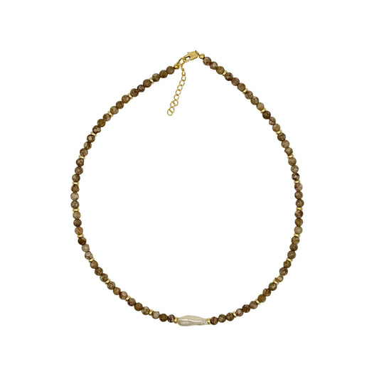 Beaded necklace on a light gray background